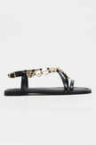 SELENE BLACK CROSS-STRAP FLAT WOMEN’S SANDALS WITH GOLD ACCENT