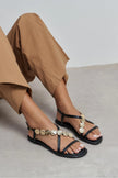 SELENE BLACK CROSS-STRAP FLAT WOMEN’S SANDALS WITH GOLD ACCENT