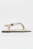 SELENE BEIGE CROSS-STRAP FLAT WOMEN’S SANDALS WITH GOLD ACCENT